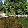 Mirror-like waters of Bear Lake in Killarney Provincial Park, Ontario Canada